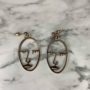 Gold abstract face earrings